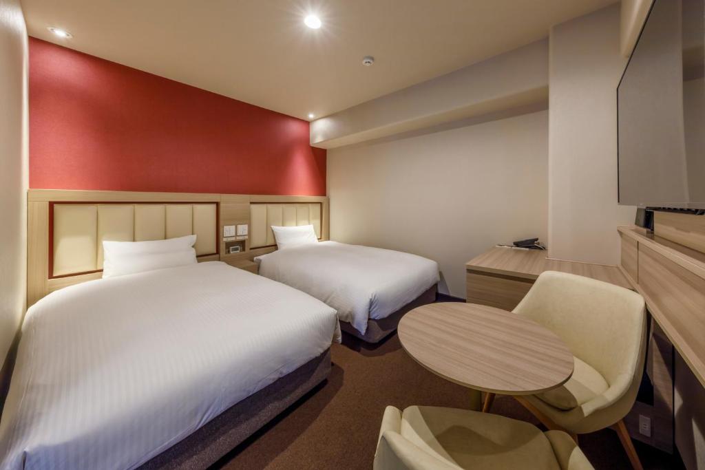 Postel nebo postele na pokoji v ubytování Via Inn Shimonoseki