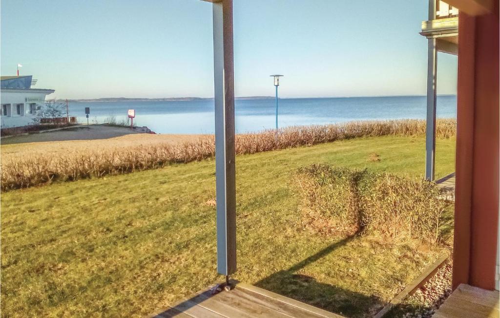 a view of the ocean from the window of a house at Amazing Apartment In Rechlin With Sauna in Rechlin