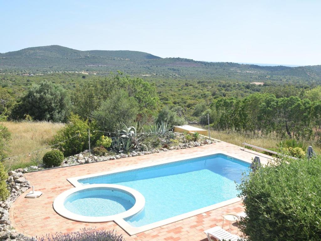 A view of the pool at Attractive Portuguese farm with modern decoration or nearby