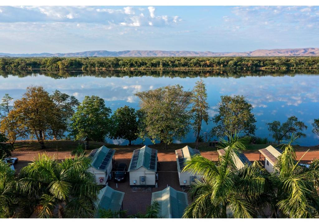 an aerial view of a lake with trees and houses at Discovery Parks - Lake Kununurra in Kununurra