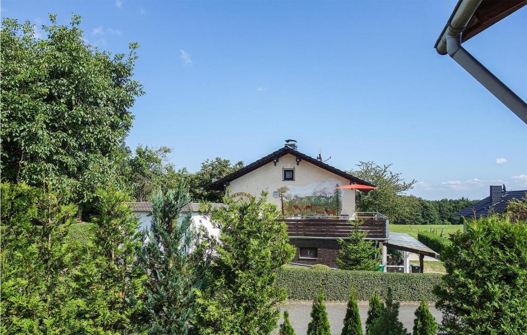 a house in the middle of a garden at Nice Apartment In Jesberg - Densberg With Wifi in Densberg