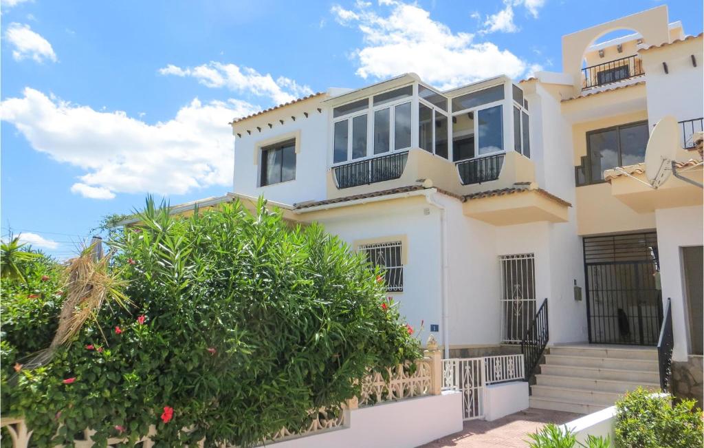 a villa with a view of the ocean at Lovely Apartment In Quesada With House A Mountain View in Rojales