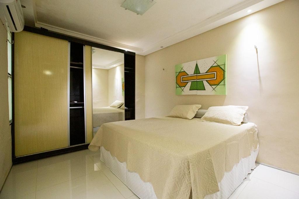 Postel nebo postele na pokoji v ubytování Porto das Dunas Casa Temporada Estilo e Conforto