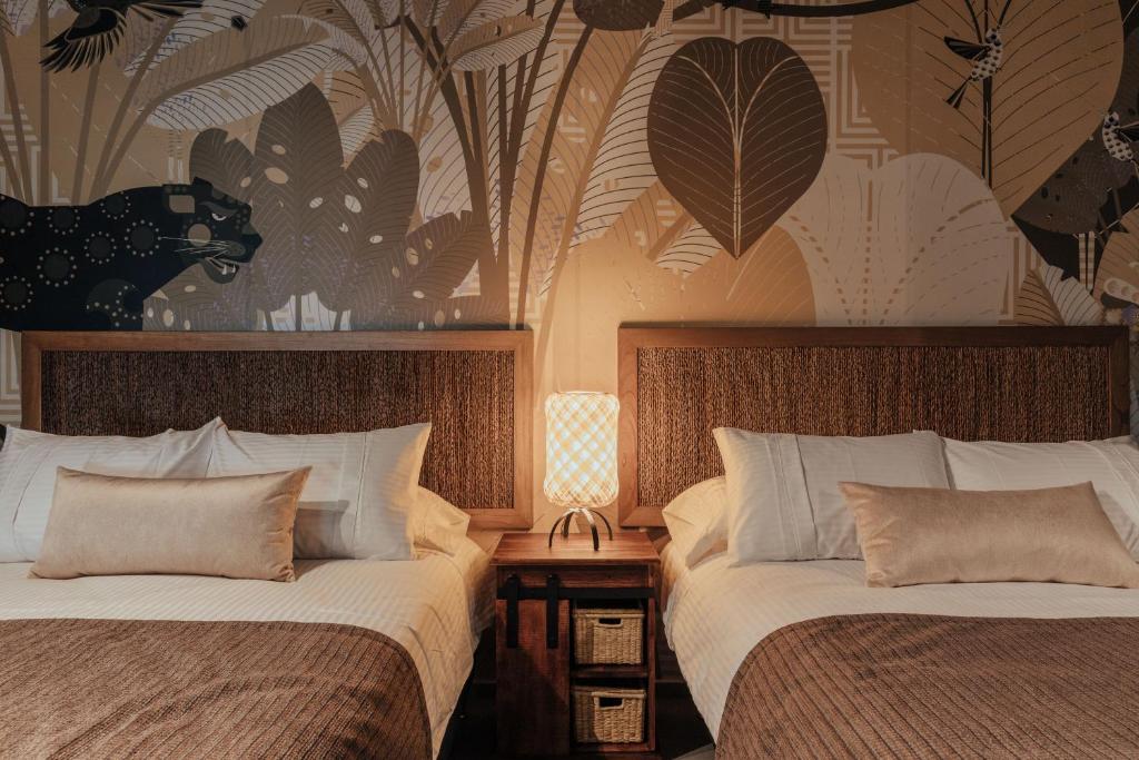 Postel nebo postele na pokoji v ubytování Sui Boutique Hotel
