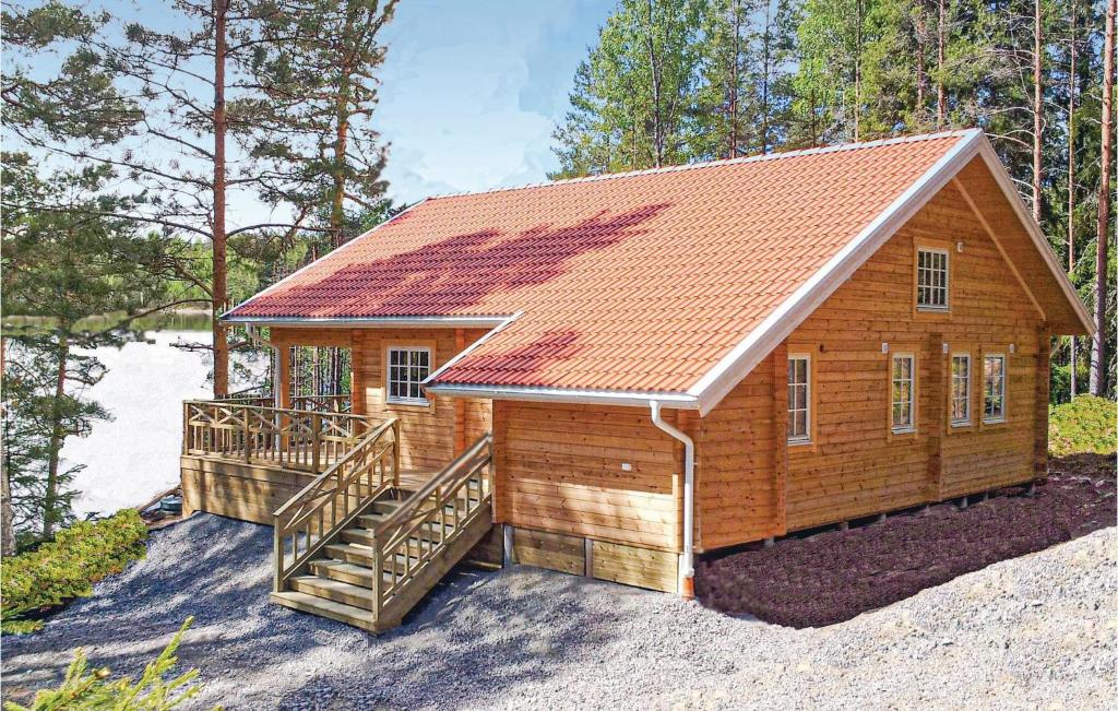 a small wooden cabin with a staircase and a roof at Awesome Home In rjng With Kitchen in Östra Viker