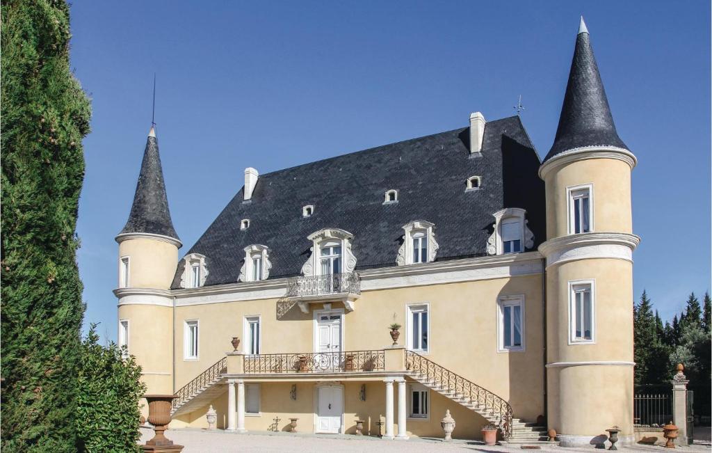 a castle with two towers on top of it at Stunning Home In Pont Saint Esprit With Kitchen in Pont-Saint-Esprit