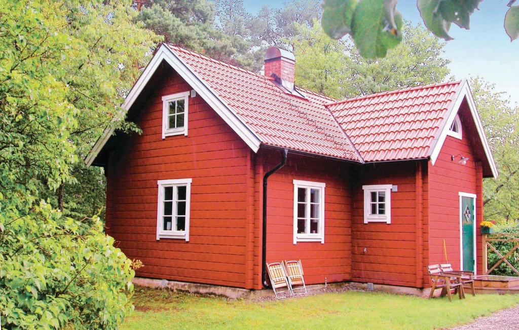 a red house with a red roof at Beautiful Home In smo With 2 Bedrooms in Ösmo