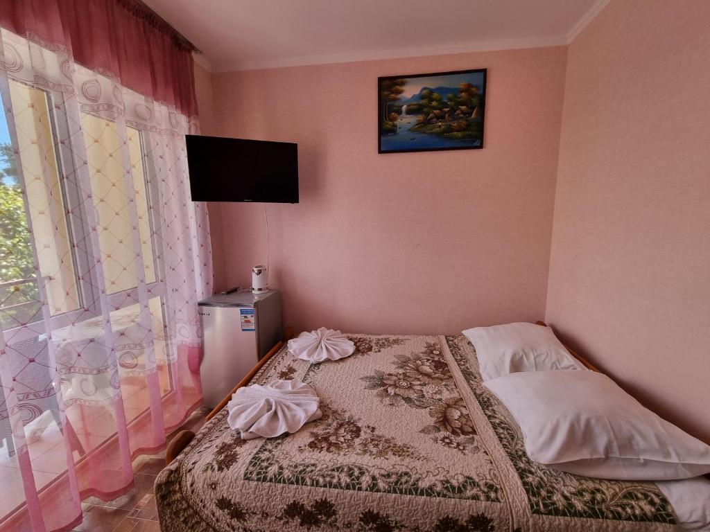 Postel nebo postele na pokoji v ubytování Guest House Moryachka