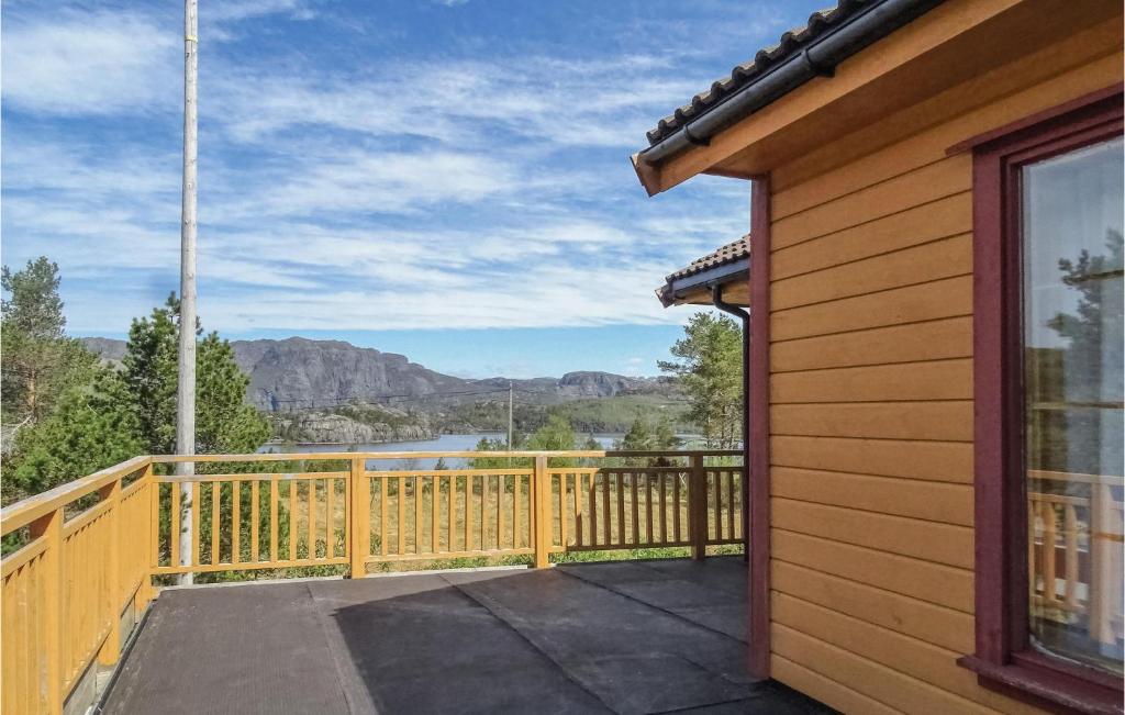 a balcony with a view of a lake and mountains at Lovely Home In Dirdal With Ethernet Internet in Dirdal