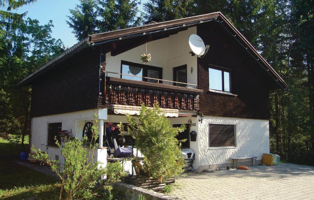 a large house with a large balcony at Amazing Apartment In Schetteregg With House A Mountain View in Egg