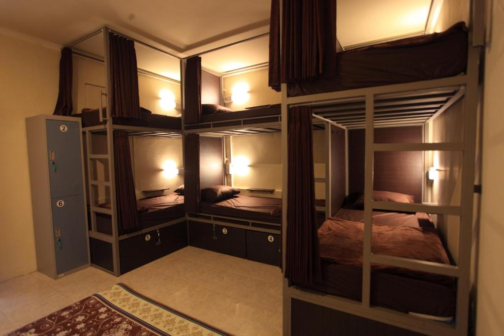 Postel nebo postele na pokoji v ubytování Jero di Bisma Hostel