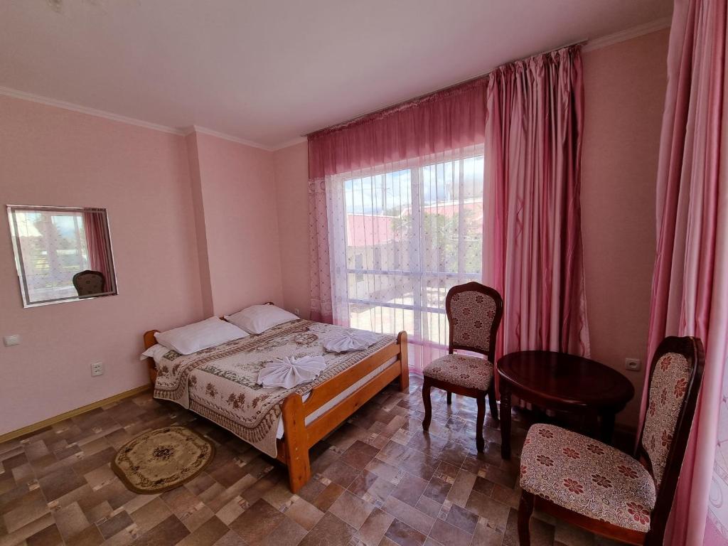 Postel nebo postele na pokoji v ubytování Guest House Moryachka