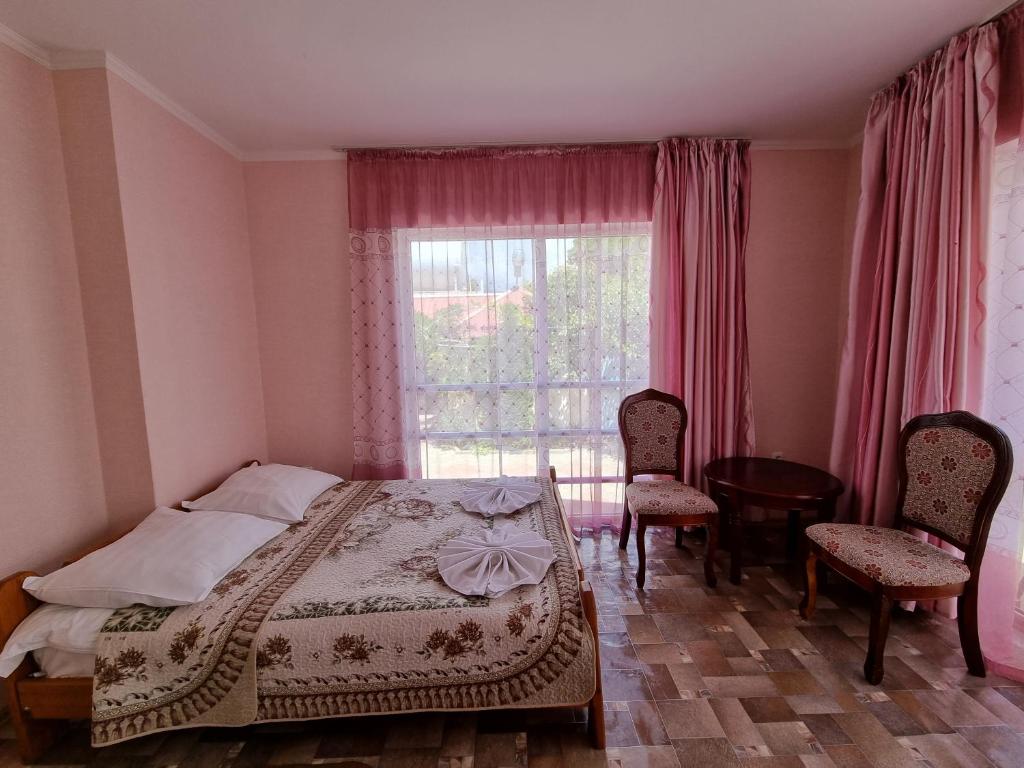 Postel nebo postele na pokoji v ubytování Guest House Moryachka