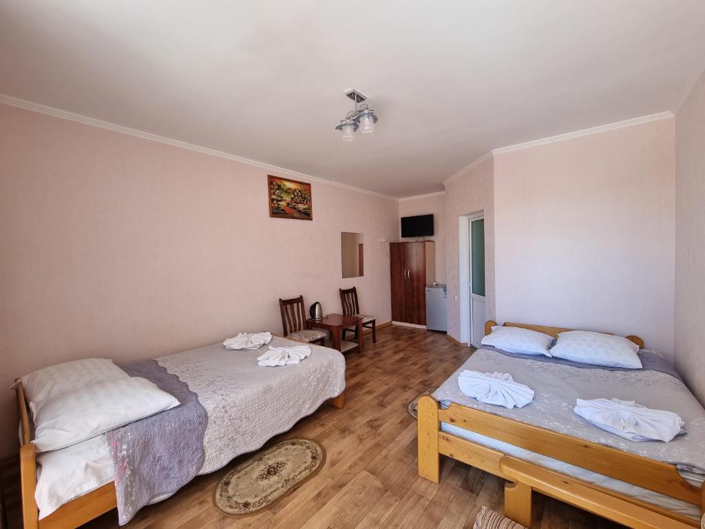 Postel nebo postele na pokoji v ubytování Guest House Moryachka