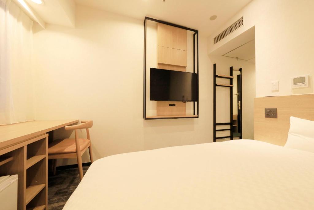 Postel nebo postele na pokoji v ubytování Via Inn Prime Akasaka