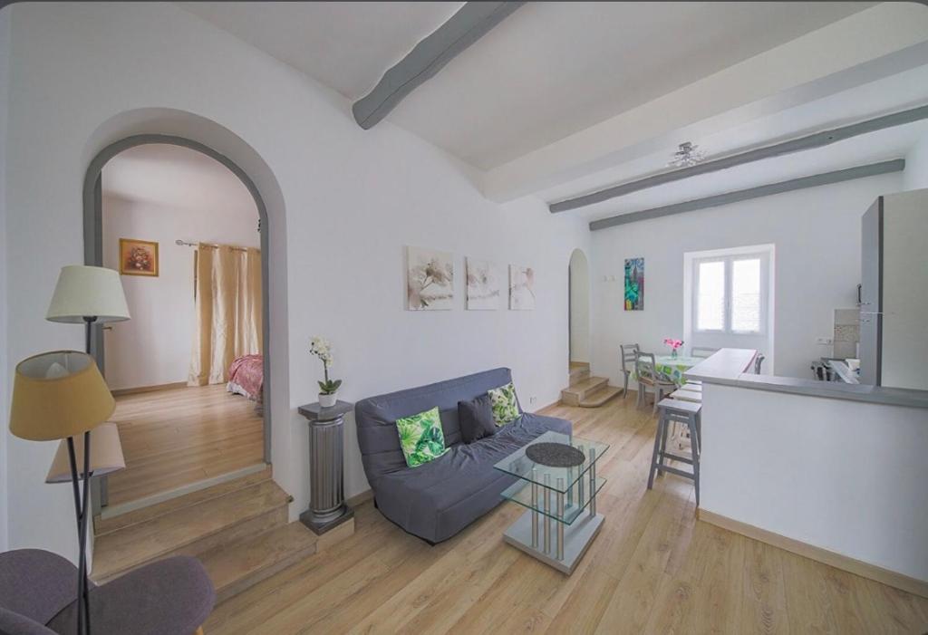 a living room with a couch and a table at Gîte Emma in Santo-Pietro-di-Tenda