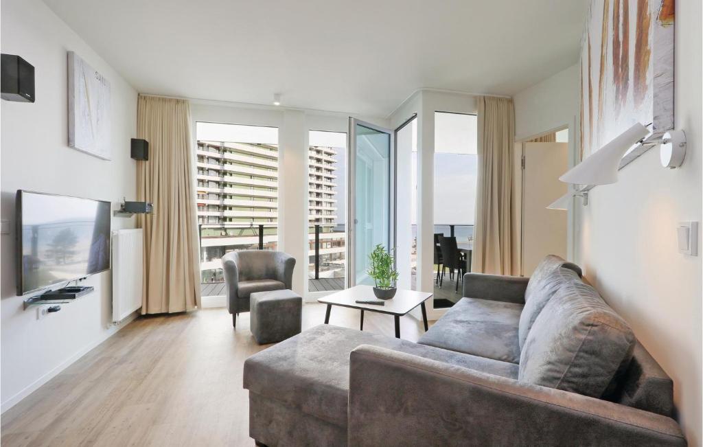 a living room with a couch and a table at Highend Travemünde - Whg 415 in Travemünde