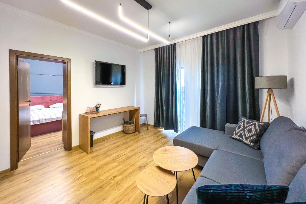 TV a/nebo společenská místnost v ubytování Deluxe Central Rooms