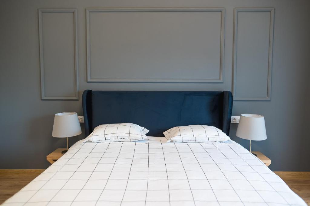 Postel nebo postele na pokoji v ubytování Deluxe Central Rooms