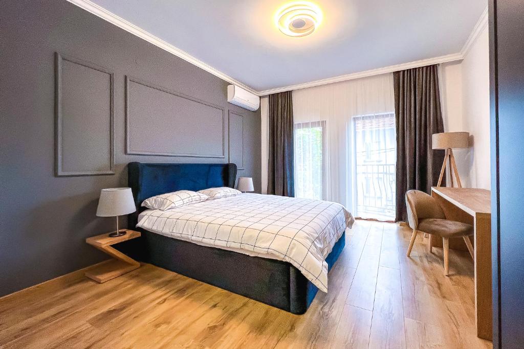Postel nebo postele na pokoji v ubytování Deluxe Central Rooms