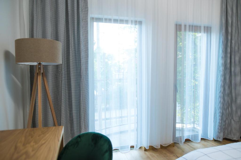 Postel nebo postele na pokoji v ubytování Deluxe Central Rooms