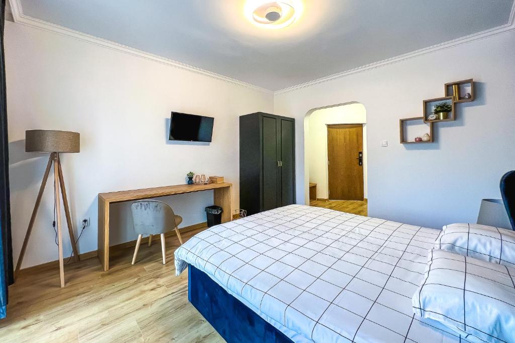 Postel nebo postele na pokoji v ubytování Deluxe Central Rooms