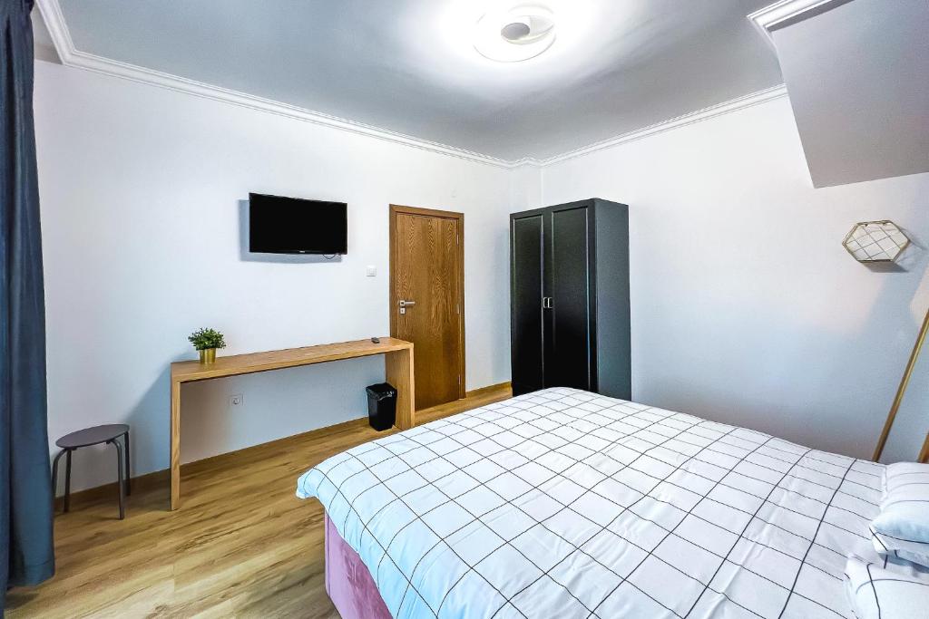 Postel nebo postele na pokoji v ubytování Deluxe Central Rooms