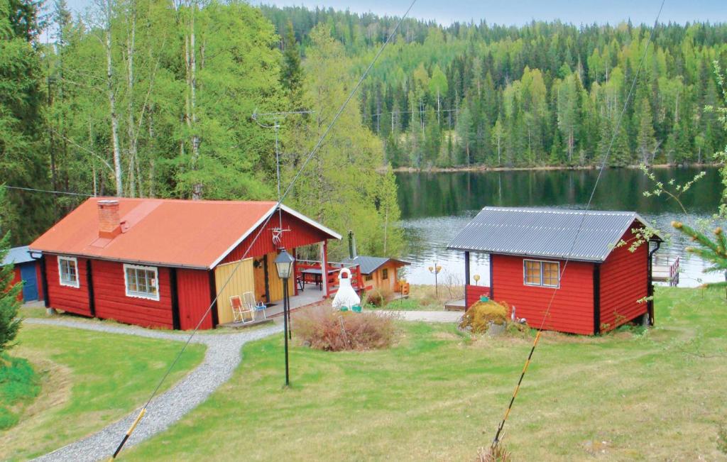 an aerial view of a house and a lake at Stunning Home In Stde With Kitchen in Stor-Hullsjön