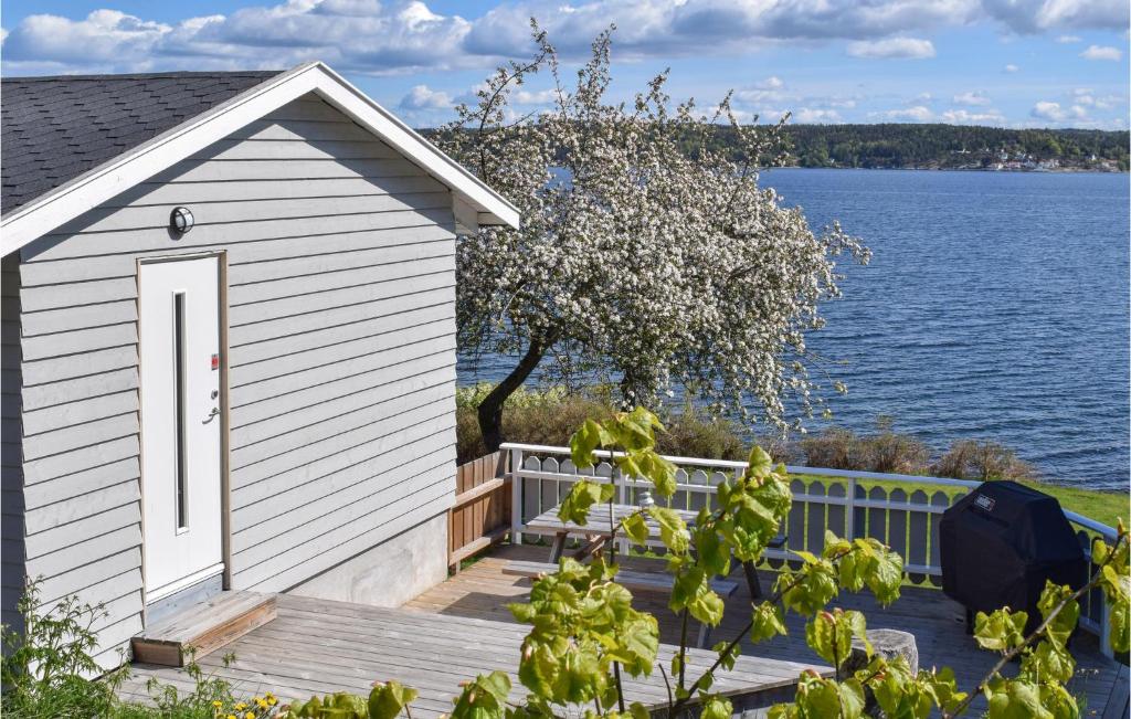 a small house on a dock next to a body of water at Stunning Home In Filtvet With 1 Bedrooms in Filtvet