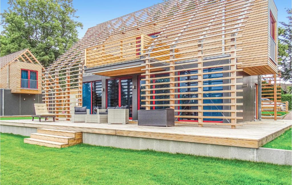 a house is being constructed with a wooden deck at Cozy Home In Kuhlen Wendorf With Wifi in Wendorf