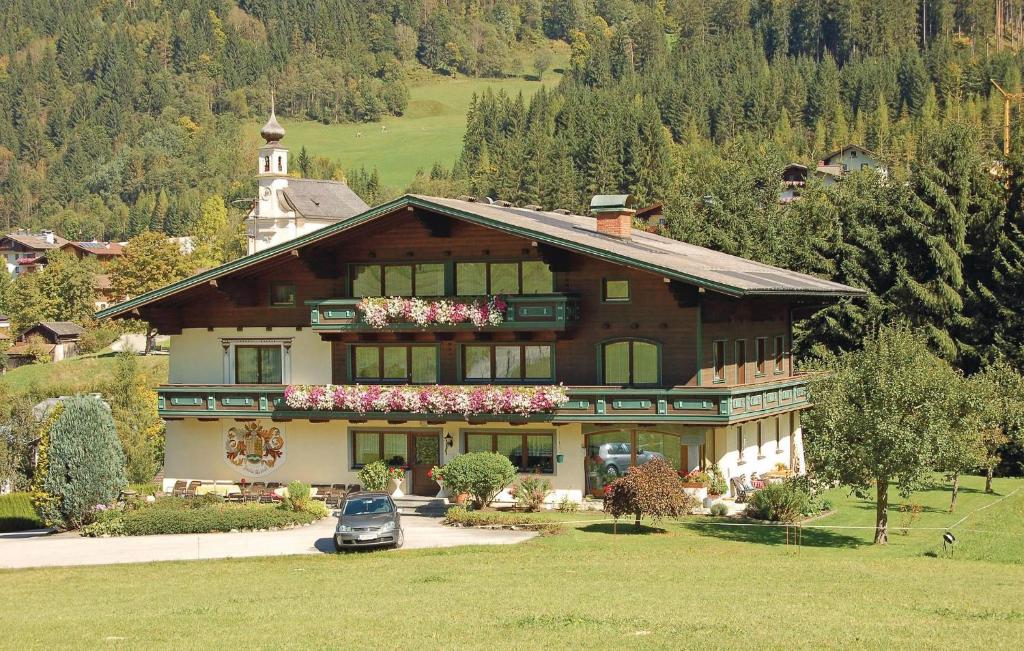 a large house with a car parked in front of it at Amazing Apartment In Flachau With 2 Bedrooms And Internet in Flachau