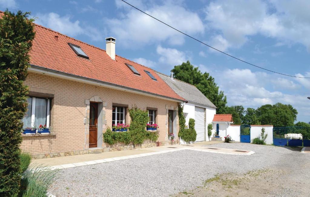 a brick house with a red roof at Nice Home In Senlecques With Kitchen in Senlecques