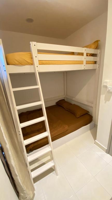Postel nebo postele na pokoji v ubytování QuiteSpace