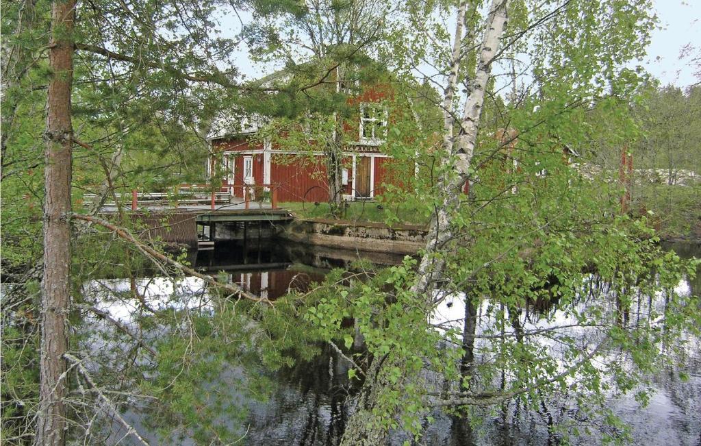 a house on a bridge over a body of water at Amazing Home In Skillingaryd With 2 Bedrooms in Ryd