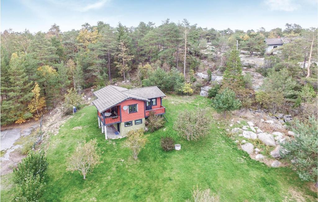 an overhead view of a red house on a grass field at Nice Home In Strmstad With 2 Bedrooms in Strömstad