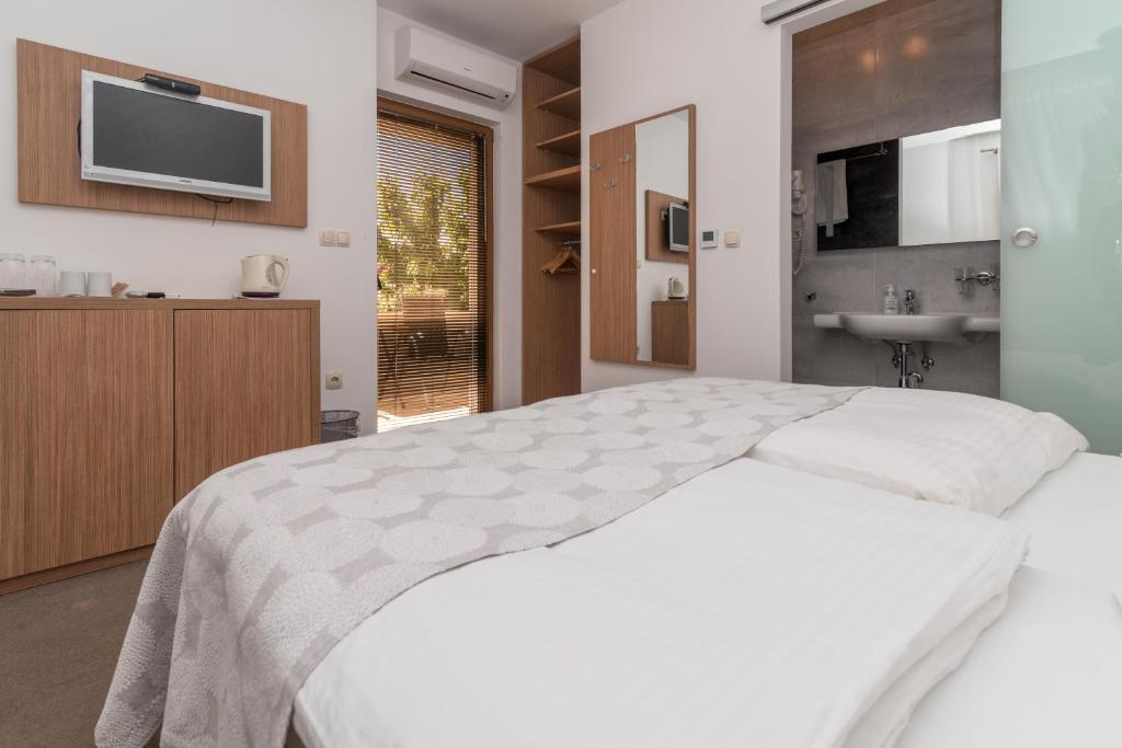 Posteľ alebo postele v izbe v ubytovaní Villa Lucica Trogir