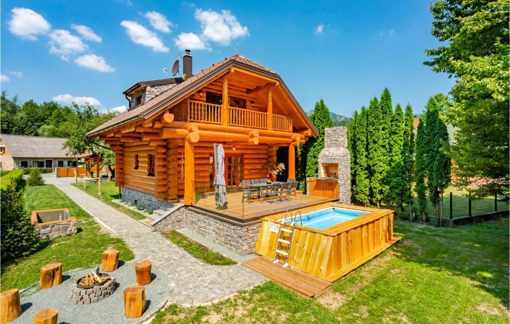 a log cabin with a pool in the yard at Cozy Home In Brod Na Kupi With Kitchen in Brod na Kupi