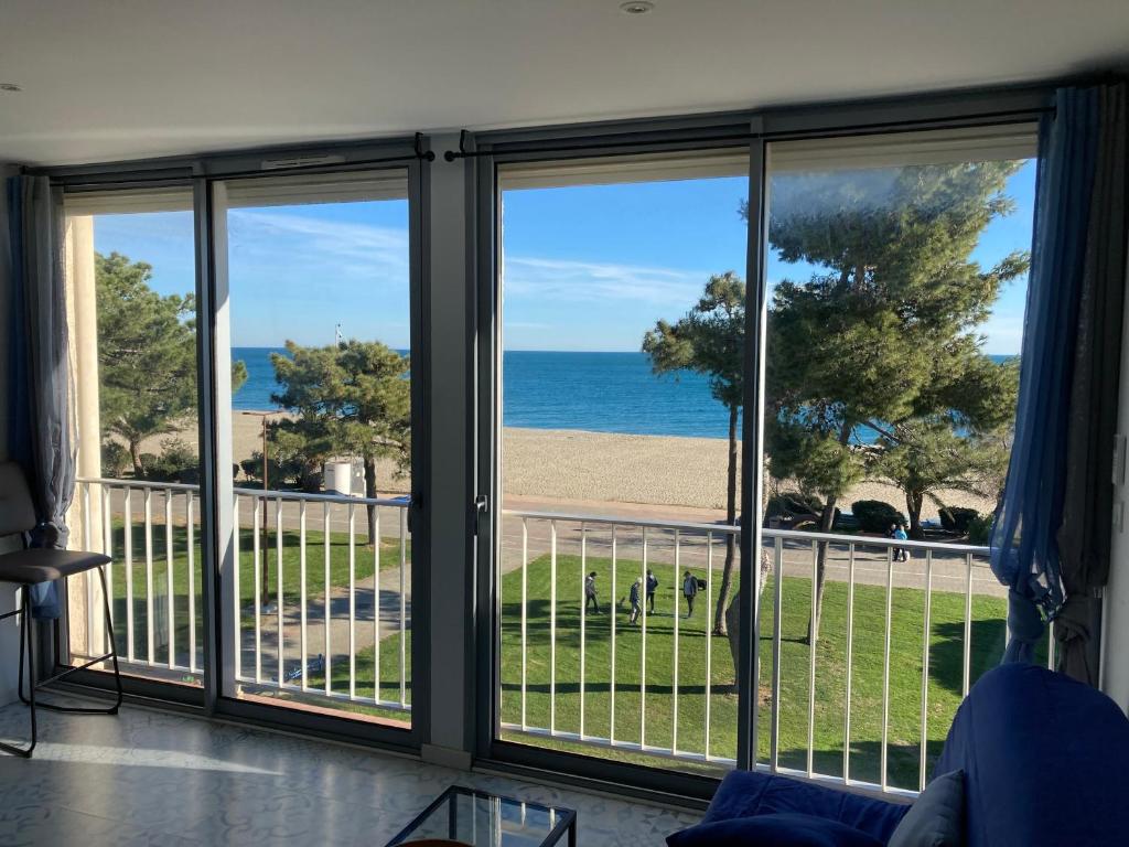 a view of the ocean from a room with windows at Appartement vue sur mer in Argelès-sur-Mer