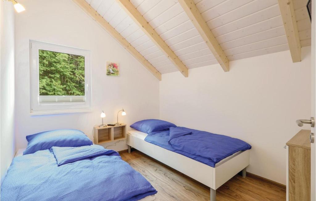 Postel nebo postele na pokoji v ubytování Ferienhausdorf Thale