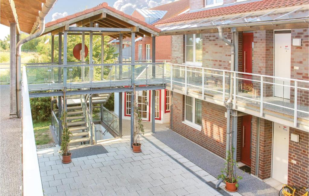 a building with a staircase on the side of it at Apt, 2 Hohen Wieschendorf in Hohen Wieschendorf