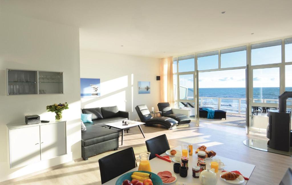 a living room with a view of the ocean at Appartement Seestern B in Schönhagen