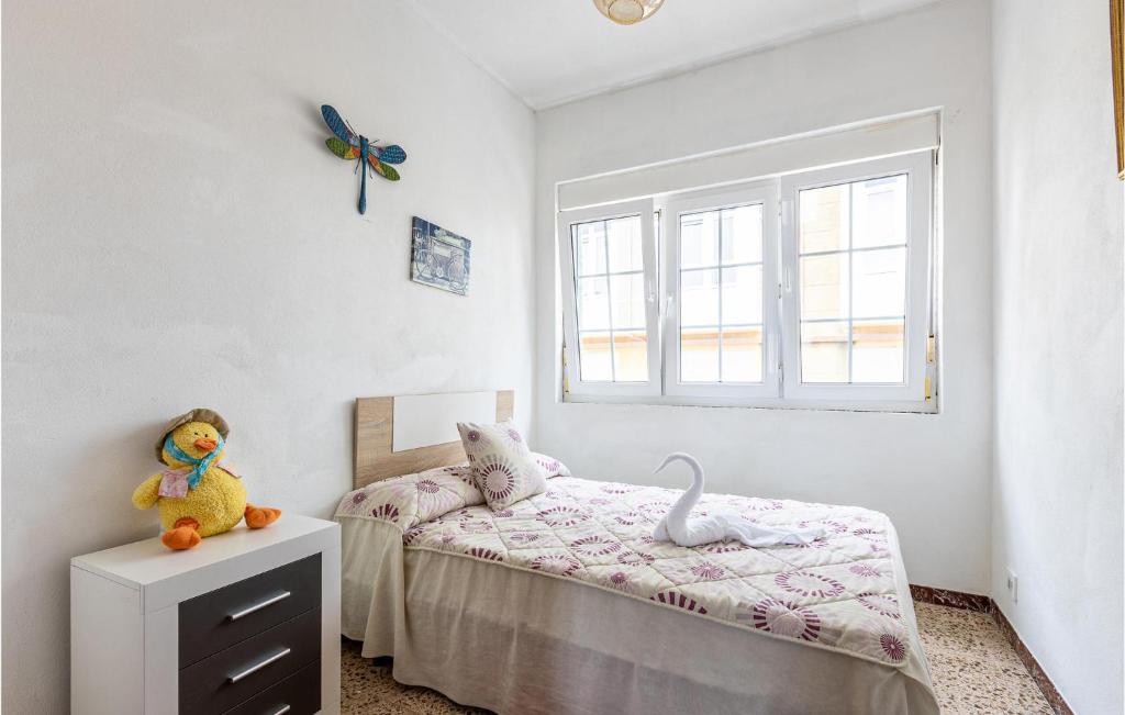 A bed or beds in a room at Stunning Home In Fisterra With Kitchen