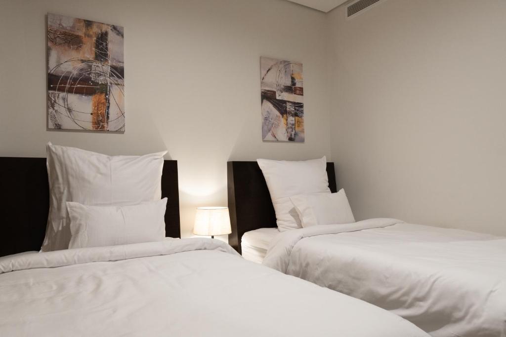 Postel nebo postele na pokoji v ubytování Mirot Hotel