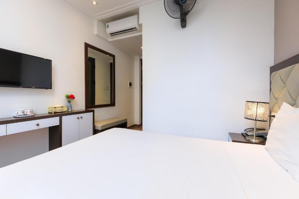 Postel nebo postele na pokoji v ubytování Yolo Wa Hotel