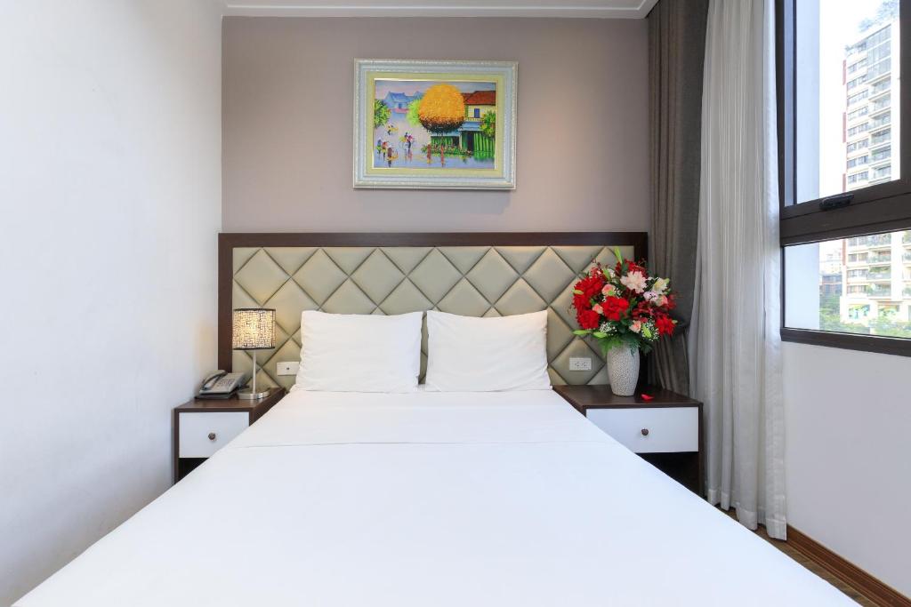Postel nebo postele na pokoji v ubytování Yolo Wa Hotel