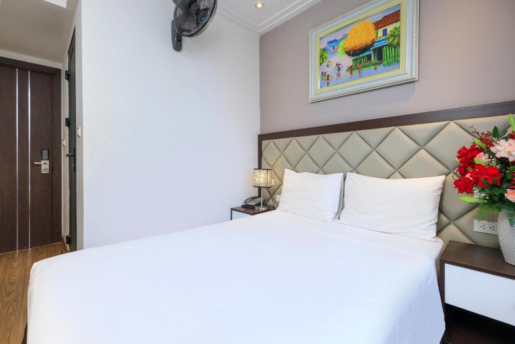Postel nebo postele na pokoji v ubytování Yolo Wa Hotel
