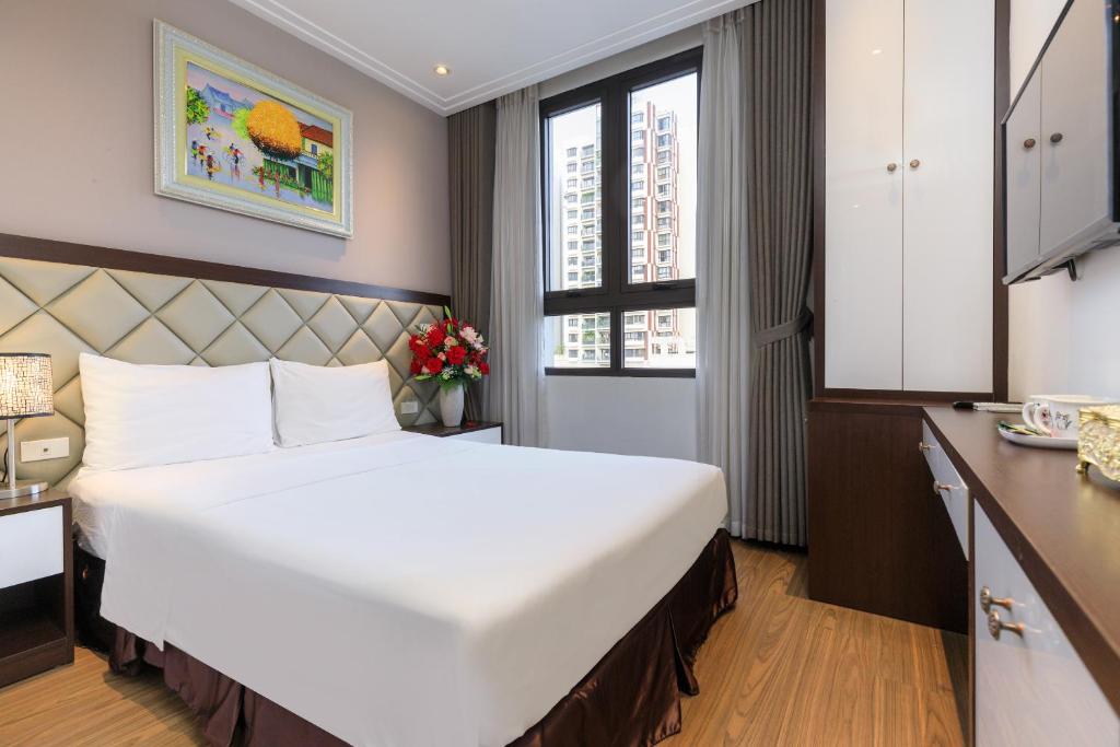 Postel nebo postele na pokoji v ubytování Yolo Wa Hotel