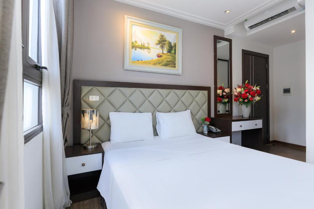 Postel nebo postele na pokoji v ubytování Yolo Wa Hotel