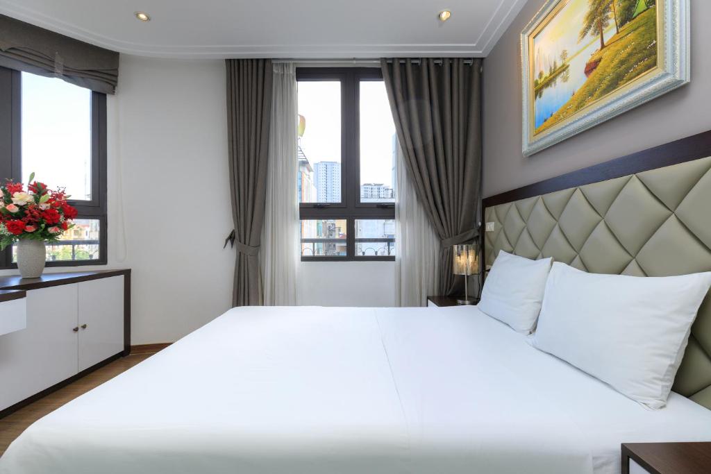 Postel nebo postele na pokoji v ubytování Yolo Wa Hotel