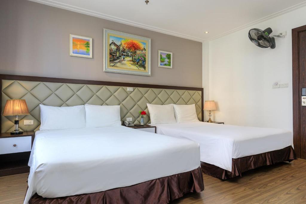 Postel nebo postele na pokoji v ubytování Yolo Wa Hotel